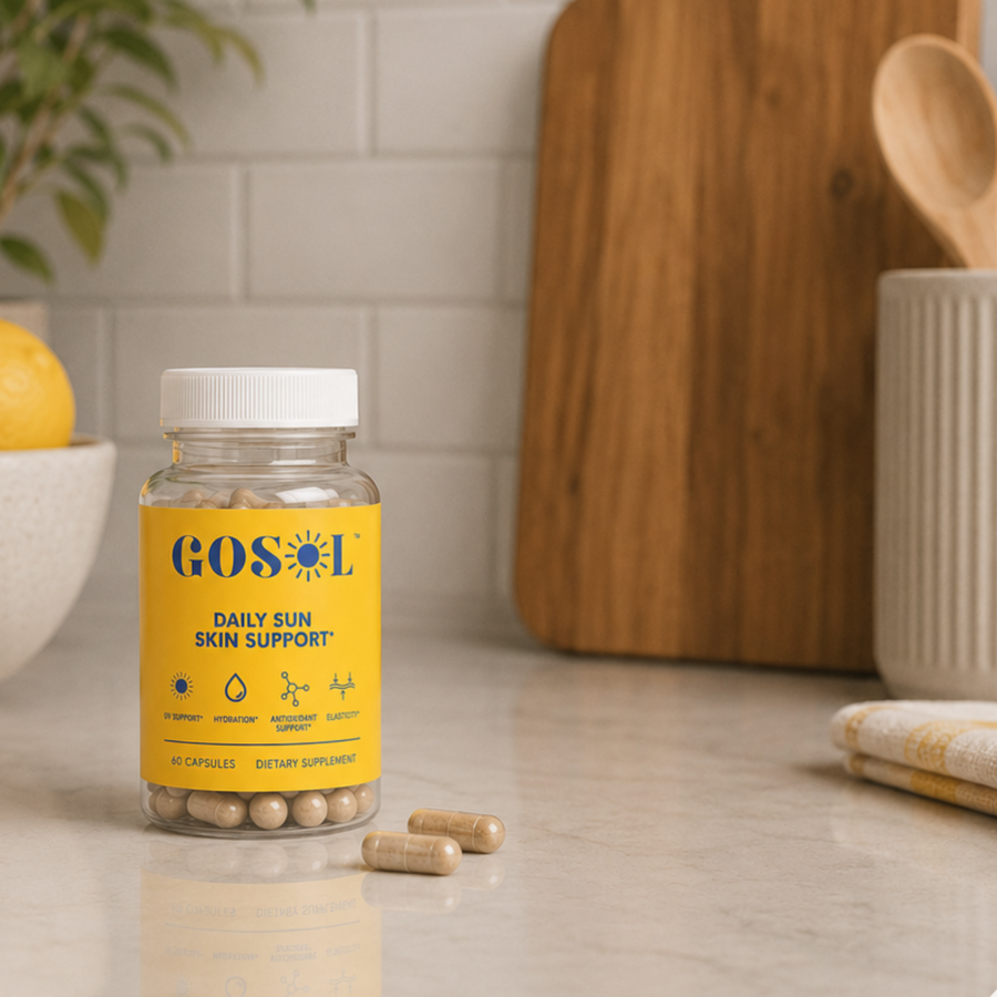 GoSol bottle sitting on countertop with bowl of yellow lemons, cutting board, and cup of utensils behind it