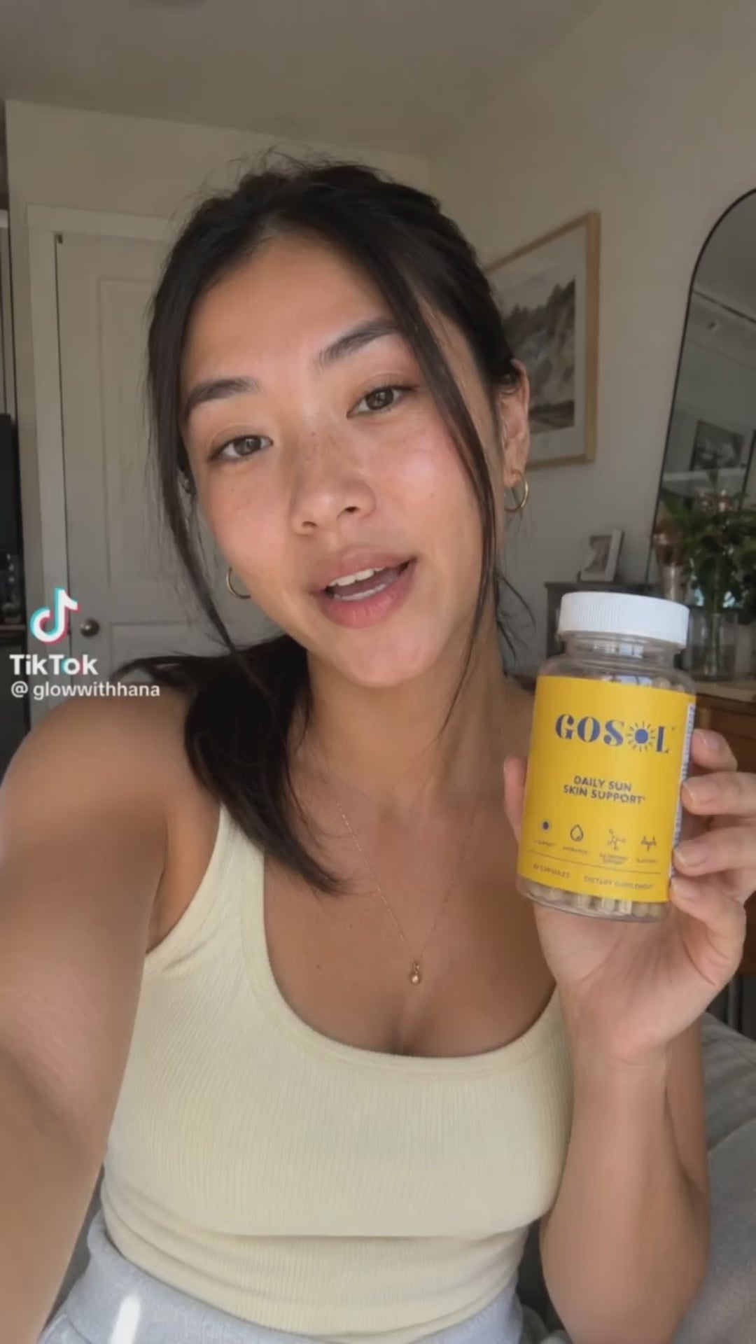 @glowwithhana from TikTok reviewing the GOSOL Daily Sun Skin Support, saying "skin is so much better".