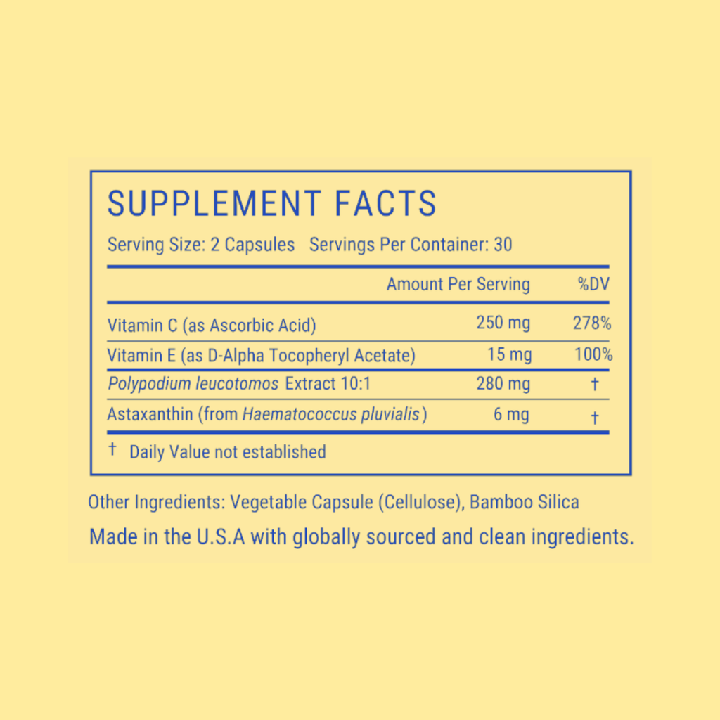 A supplement facts label printed on a pale yellow background, showing a blue-bordered nutrition panel with text for a capsule product. Visible text includes 'SUPPLEMENT FACTS,' serving size 2 capsules, and listed nutrients such as Vitamin C, Vitamin E, Polypodium leucotomos Extract 10:1, and Astaxanthin.